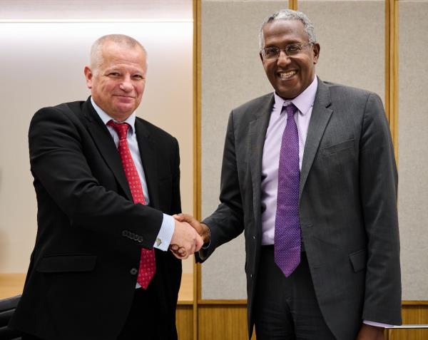 WIOCC Group CEO Chris Wood (left) with IFC vice president of industries Mohamed Gouled
